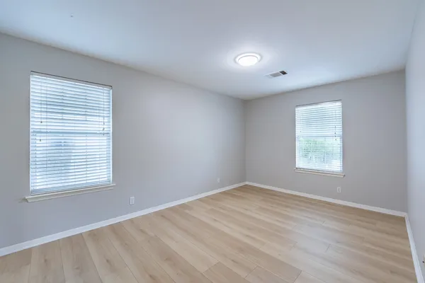a view of hallway with wooden floor