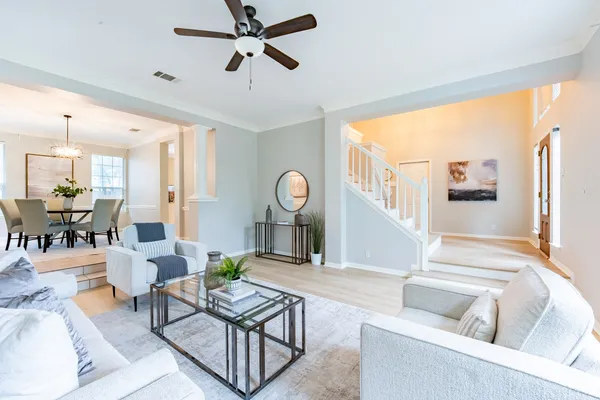a living room with furniture and windows