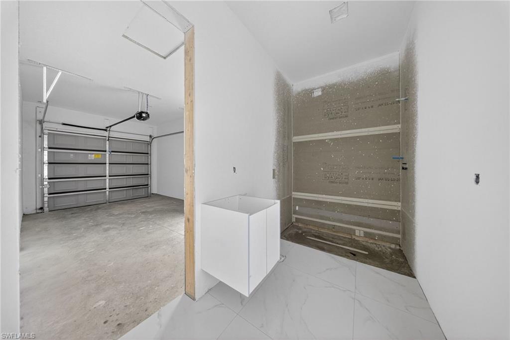 1213 Dodwin Street East Lehigh Acres, FL 33974 - Photo 18 of 28 a view of an empty walk in closet