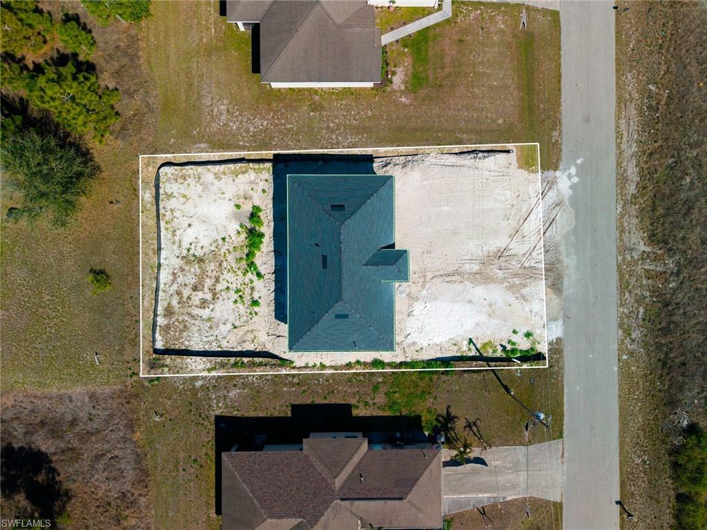 1213 Dodwin Street East Lehigh Acres, FL 33974 - Photo 24 of 28 an aerial view of a residential houses with outdoor space