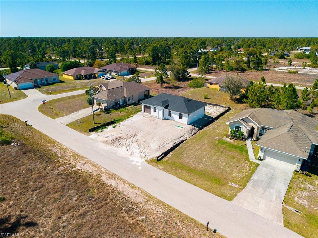1213 Dodwin Street East Lehigh Acres, FL 33974 - Photo 25 of 28 an aerial view of a house with outdoor space