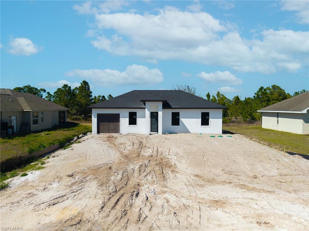 1213 Dodwin Street East Lehigh Acres, FL 33974 - Photo 28 of 28 a house with a outdoor space
