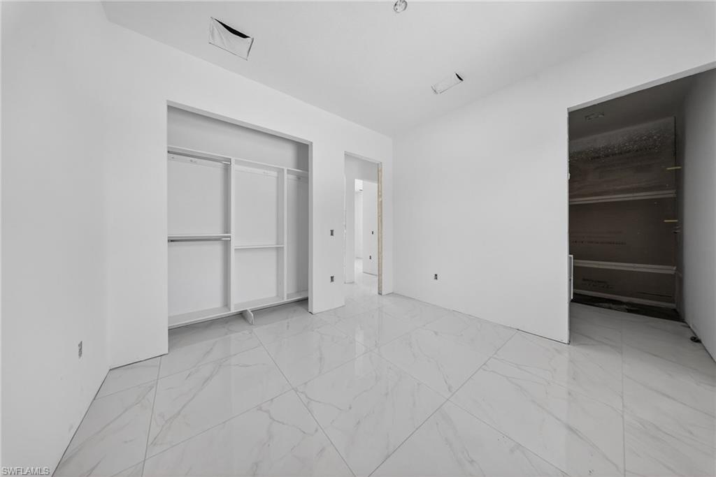 1213 Dodwin Street East Lehigh Acres, FL 33974 - Photo 3 of 28 a view of an empty room with an empty space