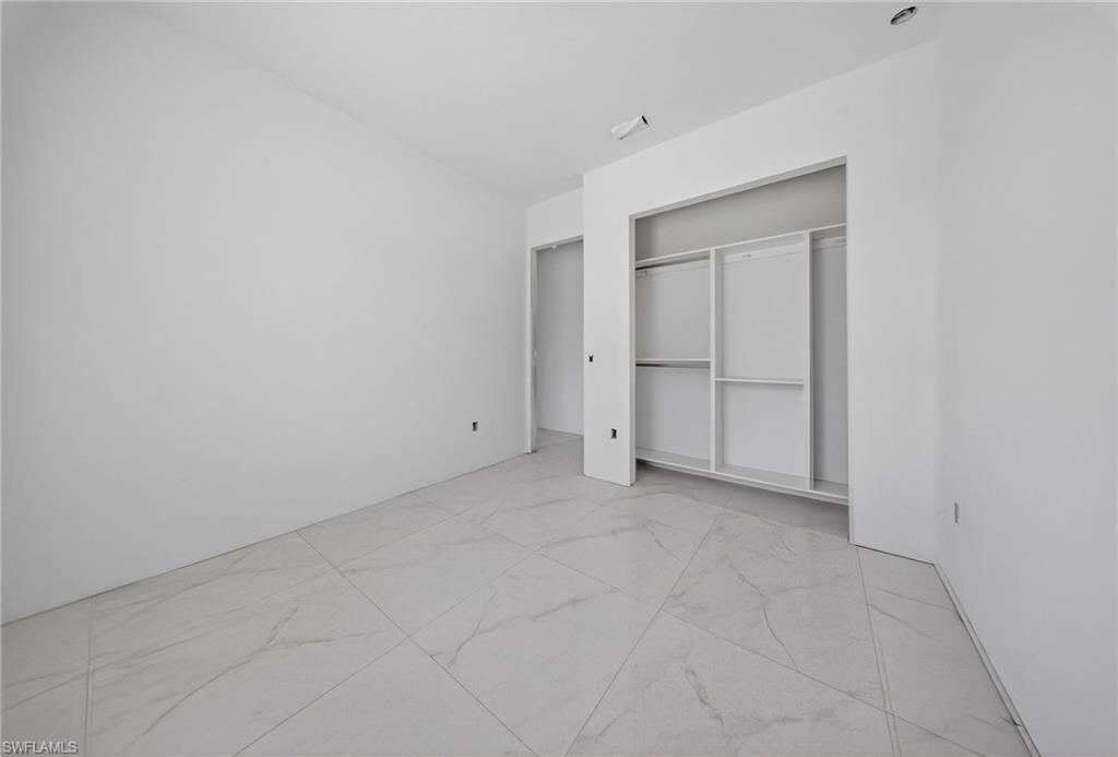 1213 Dodwin Street East Lehigh Acres, FL 33974 - Photo 4 of 28 a view of an empty room