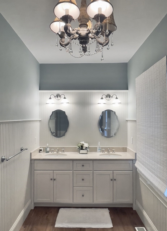 5 Pasture Road Bourne, MA 02534 - Photo 16 of 37 a bathroom with a sink a mirror and cabinets