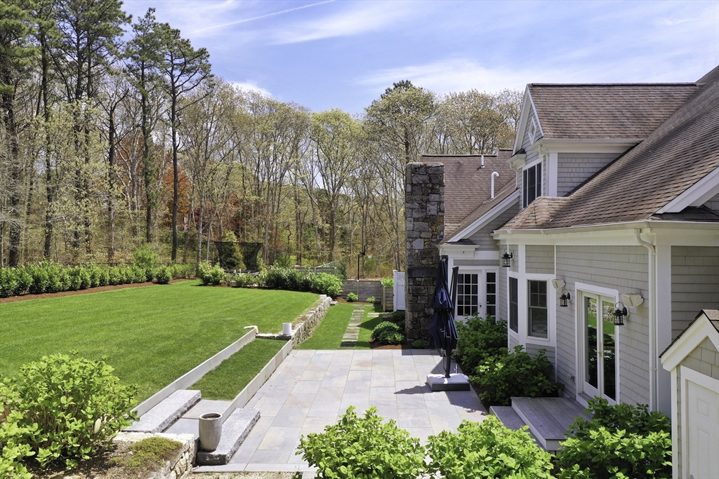 5 Pasture Road Bourne, MA 02534 - Photo 3 of 37 a house with garden in front of it