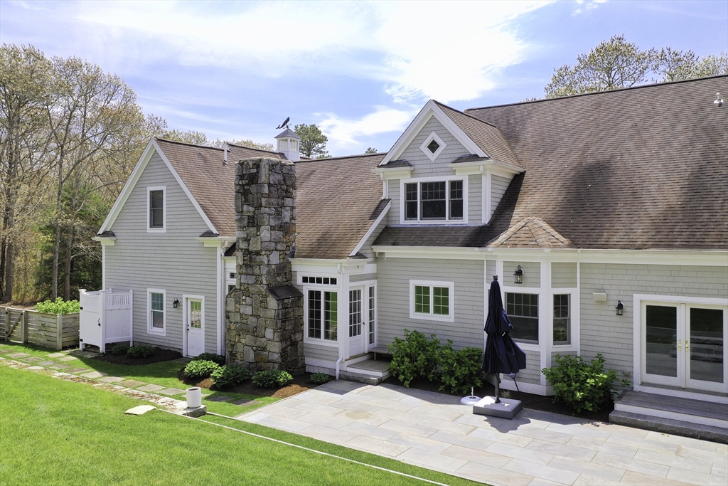 5 Pasture Road Bourne, MA 02534 - Photo 31 of 37 front view of a house with a yard