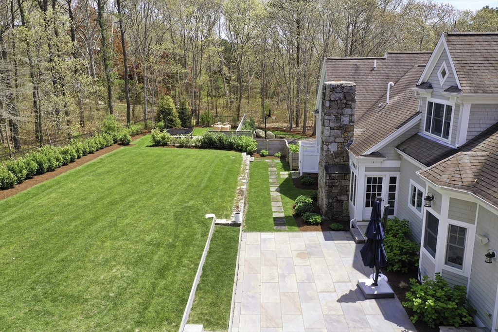 5 Pasture Road Bourne, MA 02534 - Photo 36 of 37 a view of a house with a backyard