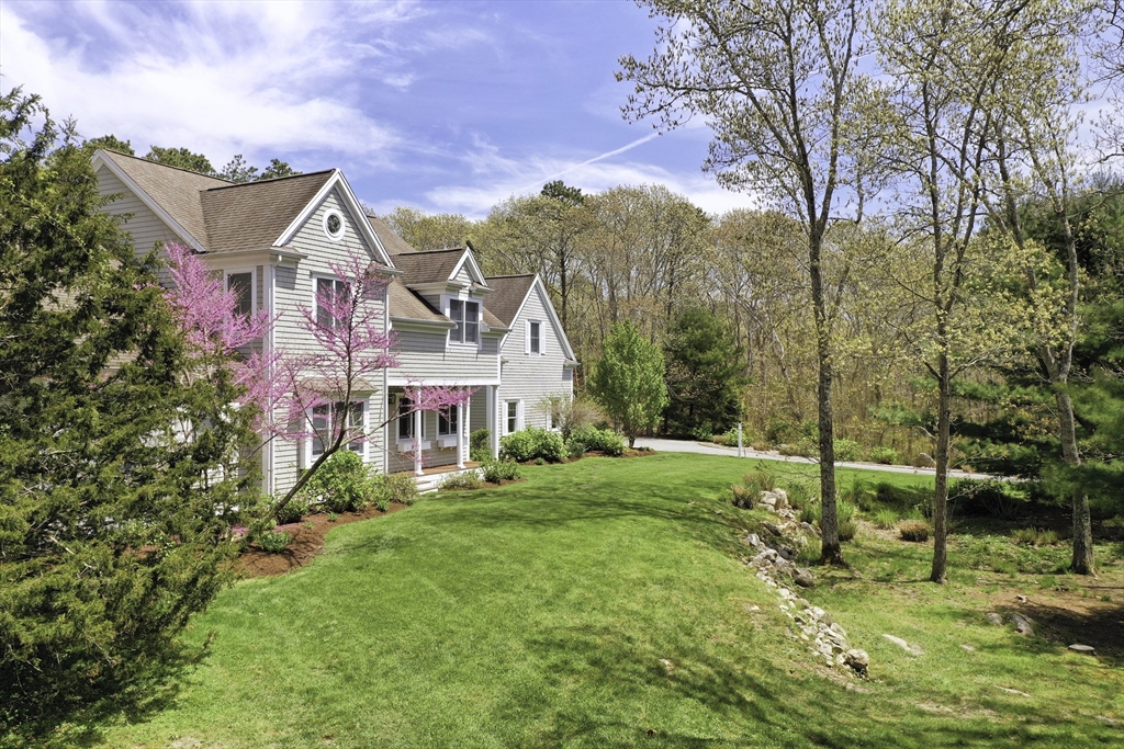 5 Pasture Road Bourne, MA 02534 - Photo 37 of 37 a view of a house with a big yard and large trees