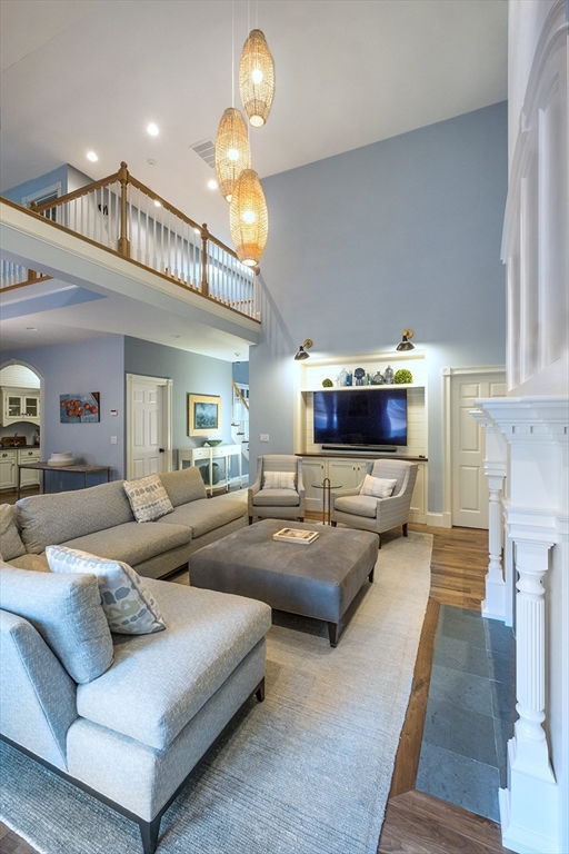 5 Pasture Road Bourne, MA 02534 - Photo 7 of 37 a living room with furniture and a chandelier