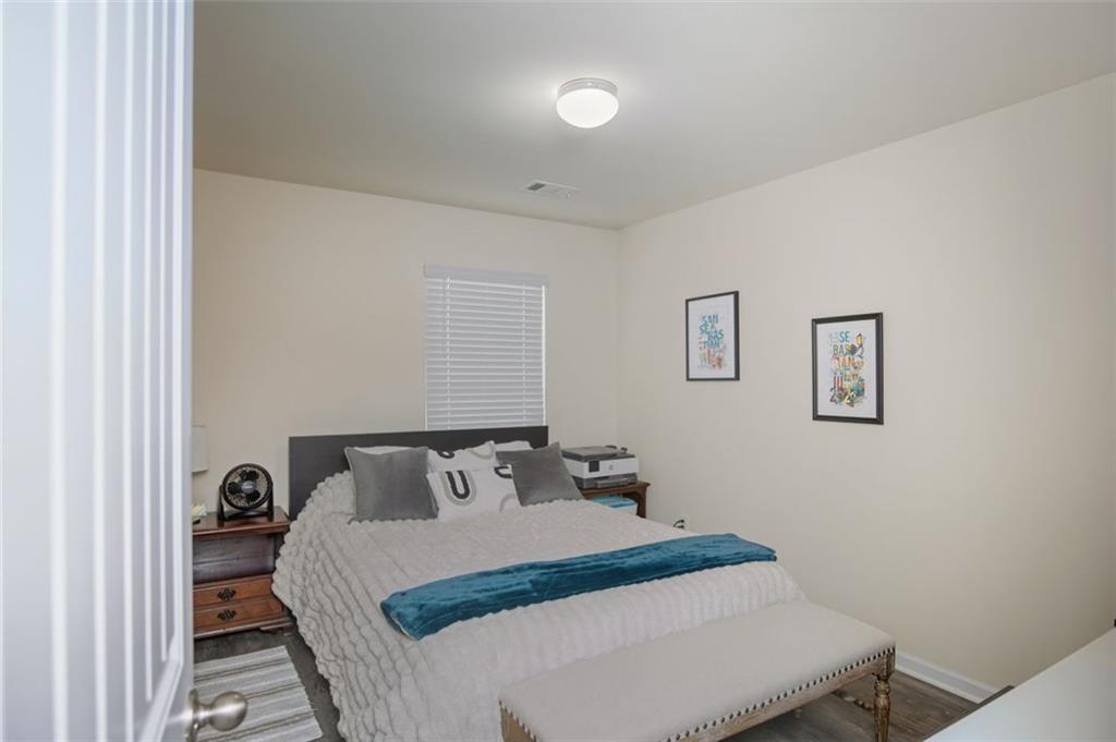 132 Centennial Ridge Drive Acworth, GA 30102 - Photo 20 of 38 a bedroom with a bed and painting on the wall