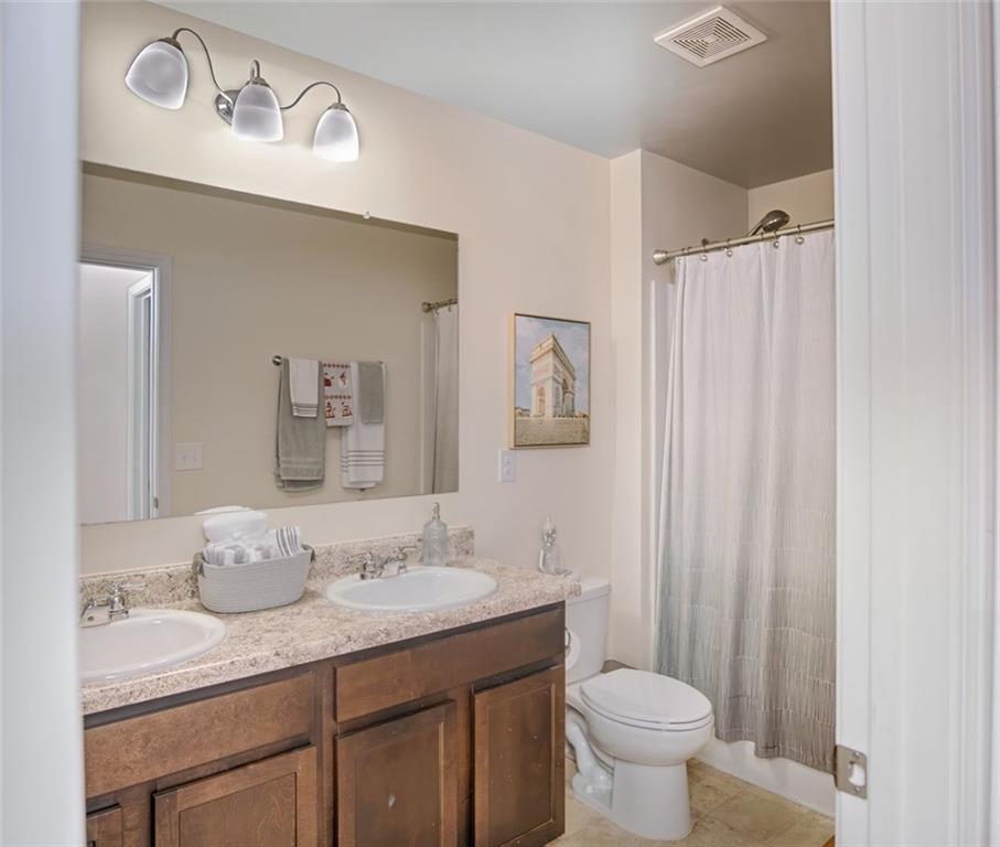 132 Centennial Ridge Drive Acworth, GA 30102 - Photo 23 of 38 a bathroom with a granite countertop sink toilet and a mirror
