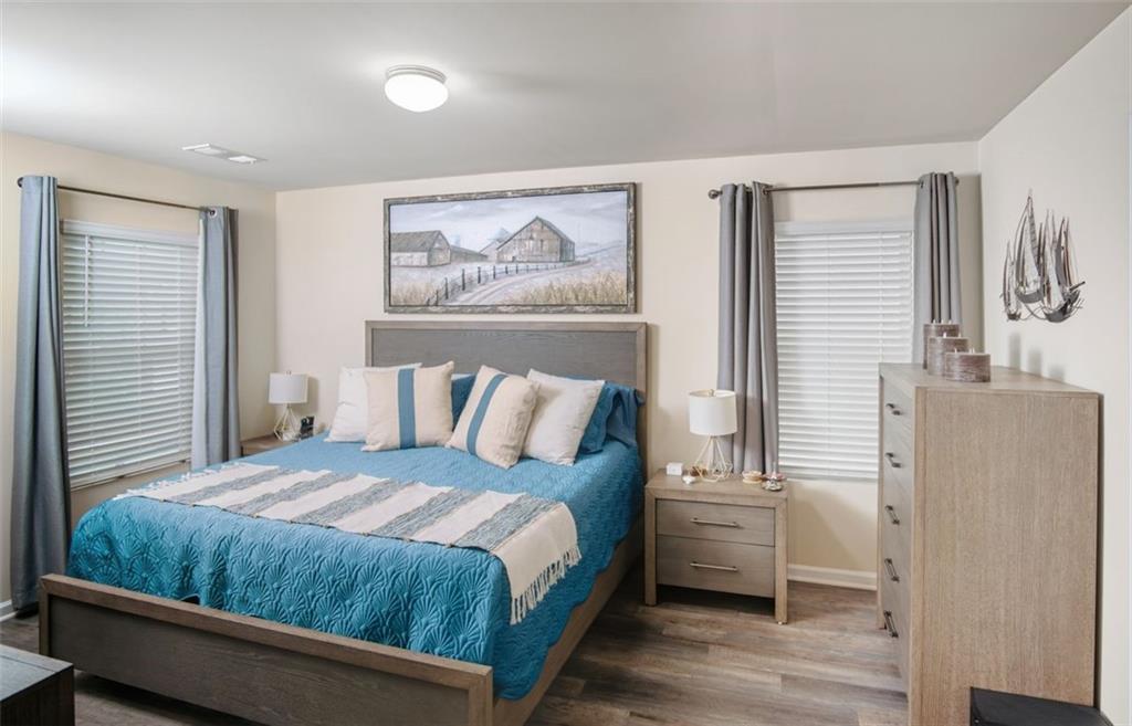 132 Centennial Ridge Drive Acworth, GA 30102 - Photo 25 of 38 a bedroom with a bed and a painting on the wall