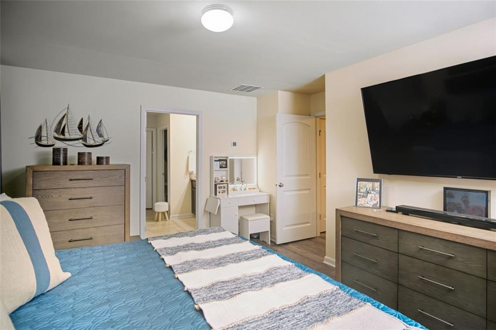 132 Centennial Ridge Drive Acworth, GA 30102 - Photo 27 of 38 a living room with furniture and a flat screen tv