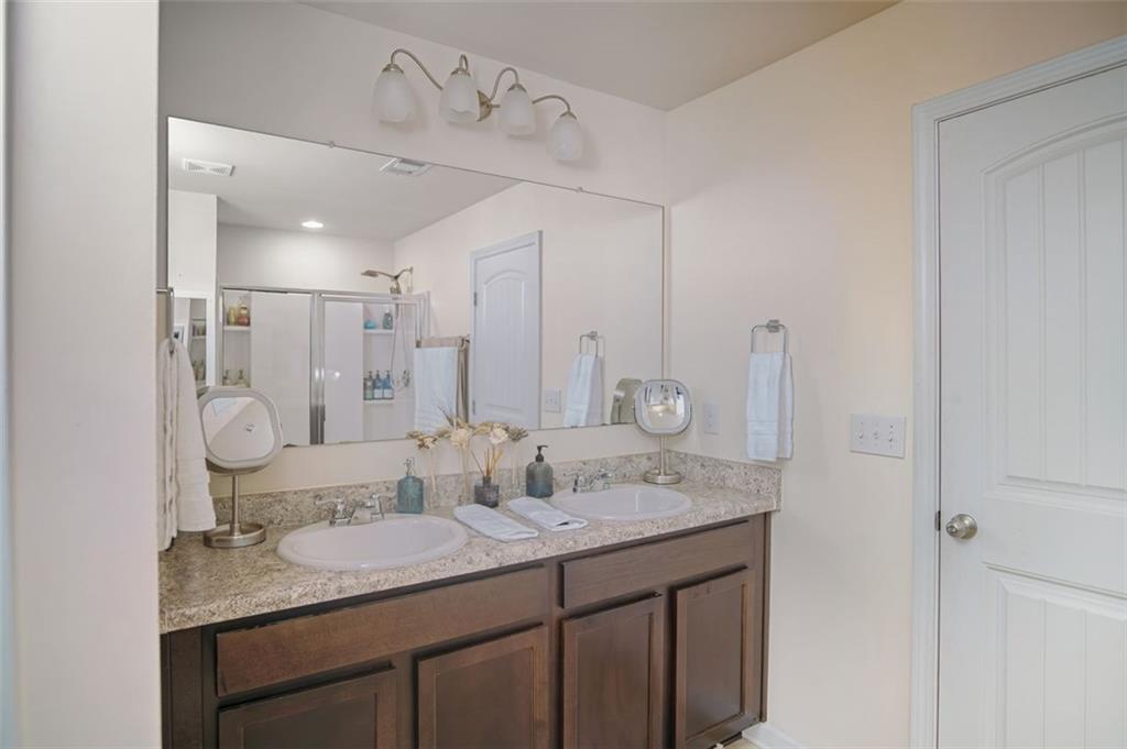 132 Centennial Ridge Drive Acworth, GA 30102 - Photo 28 of 38 a bathroom with a granite countertop sink and a mirror