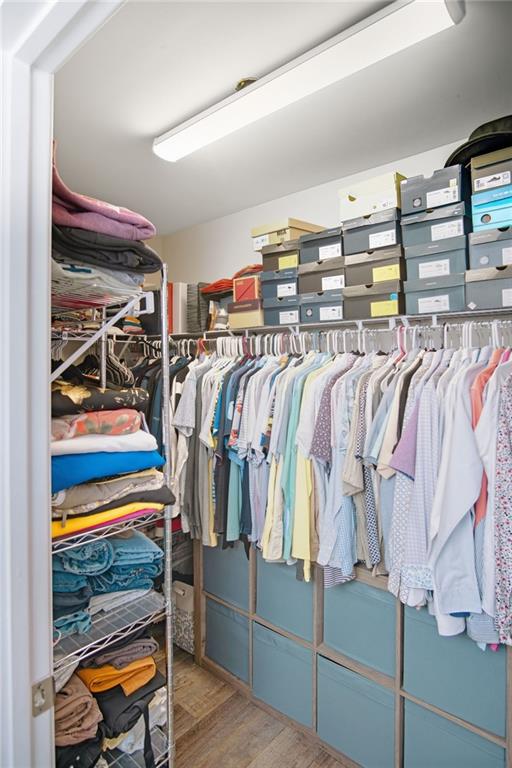 132 Centennial Ridge Drive Acworth, GA 30102 - Photo 31 of 38 a view of walk in closet with clothes and shoes