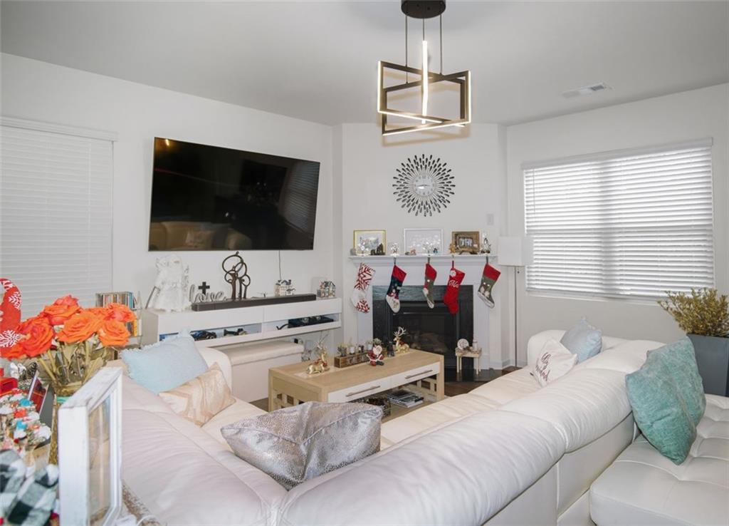 132 Centennial Ridge Drive Acworth, GA 30102 - Photo 4 of 38 a living room with furniture and a flat screen tv