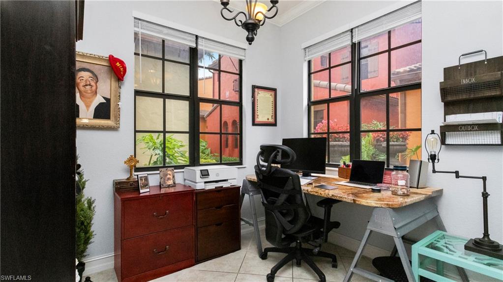 9080 Chula Vista Street, Unit 10401 Naples, FL 34113 - Photo 13 of 49 a workspace with a large window