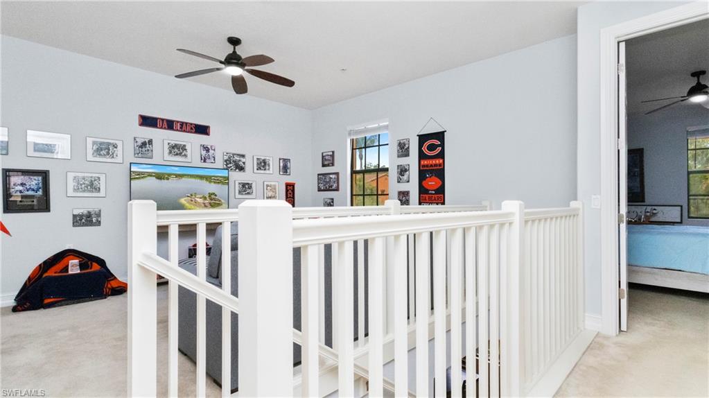9080 Chula Vista Street, Unit 10401 Naples, FL 34113 - Photo 21 of 49 a bedroom with furniture a baby crib and a window