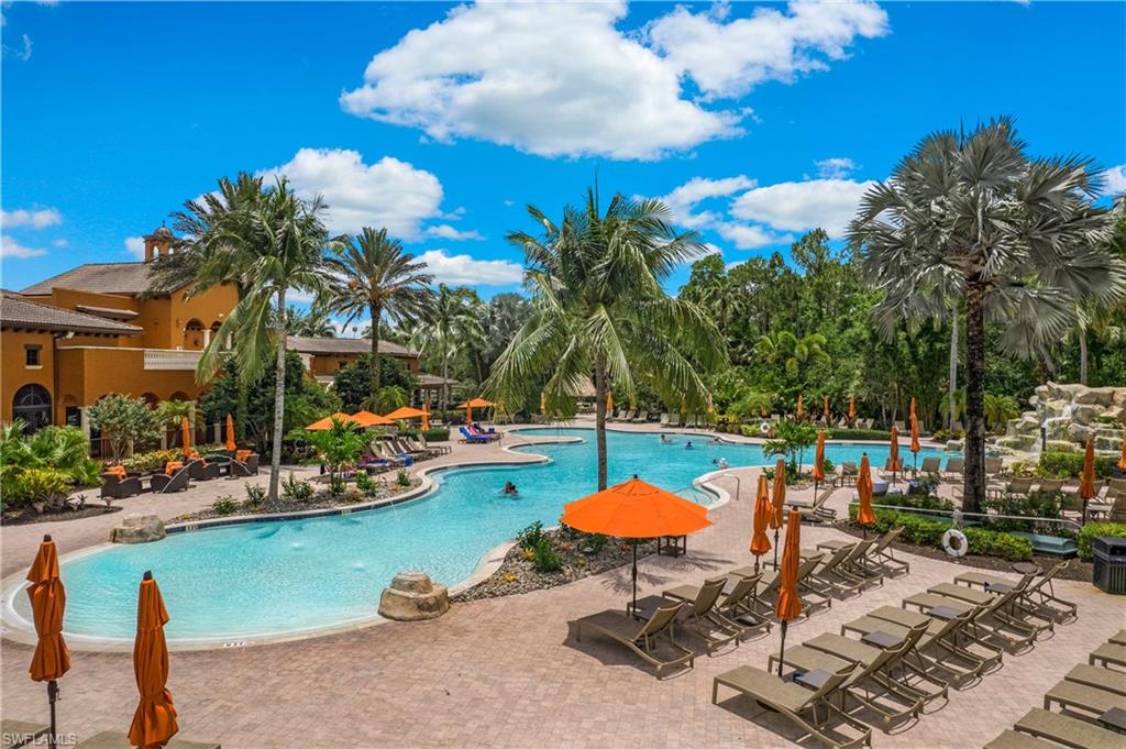 9080 Chula Vista Street, Unit 10401 Naples, FL 34113 - Photo 37 of 49 a swimming pool with outdoor seating