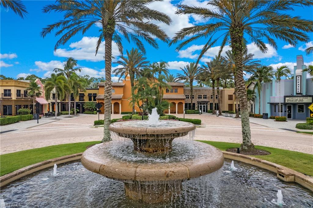 9080 Chula Vista Street, Unit 10401 Naples, FL 34113 - Photo 39 of 49 a view of a fountain in front of a house