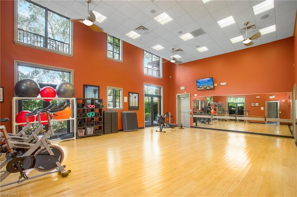 9080 Chula Vista Street, Unit 10401 Naples, FL 34113 - Photo 44 of 49 a view of a room with gym equipment