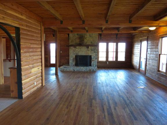 50 Clay Jones Road Taft, TN 38488 - Photo 5 of 20 The warm tones of wood and an over-sized stone fireplace adds to the awesome views.
