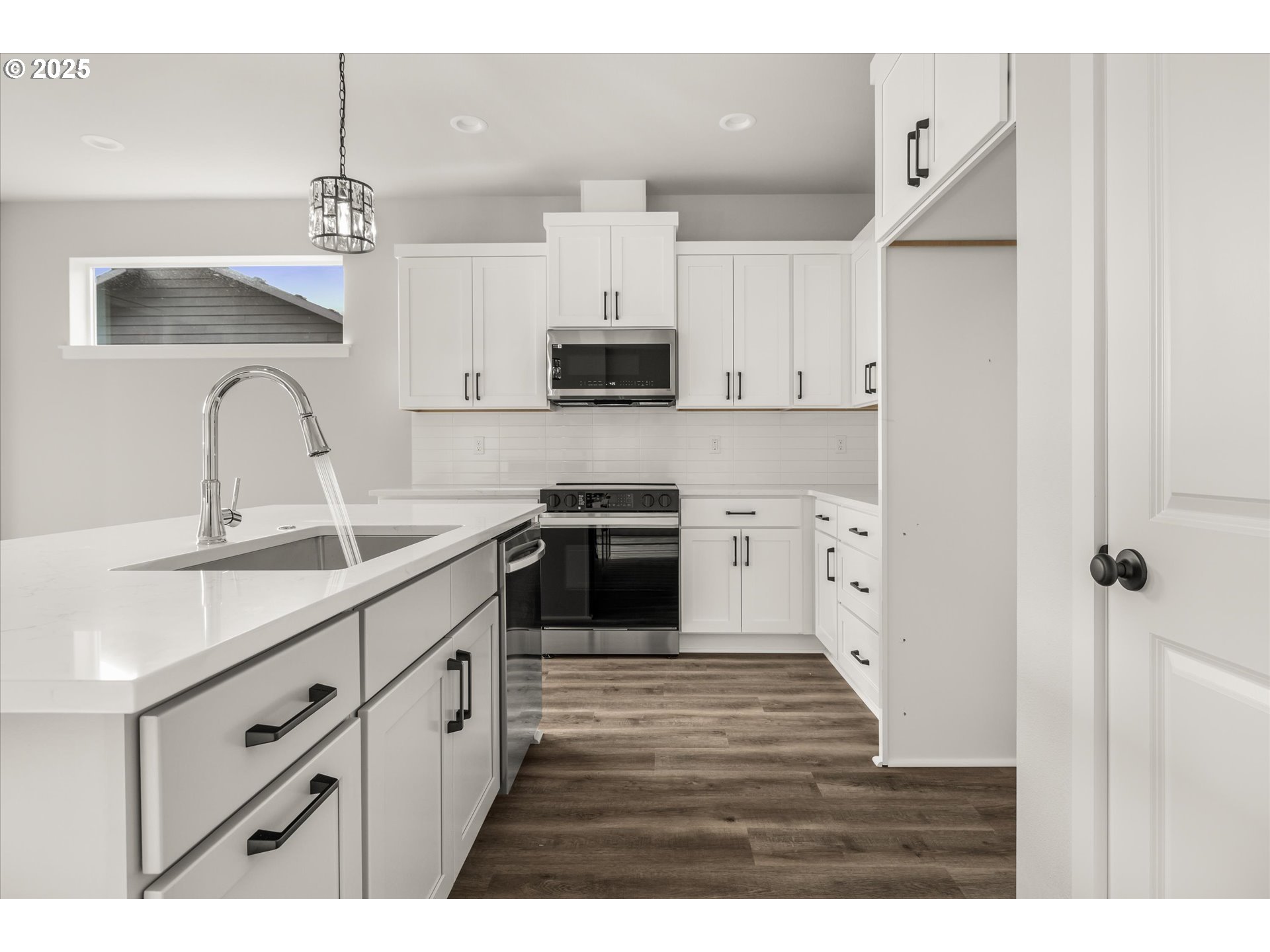 2360 Northwest 3rd Street Gresham, OR 97030 - Photo 13 of 45 a kitchen with kitchen island a sink stainless steel appliances and cabinets