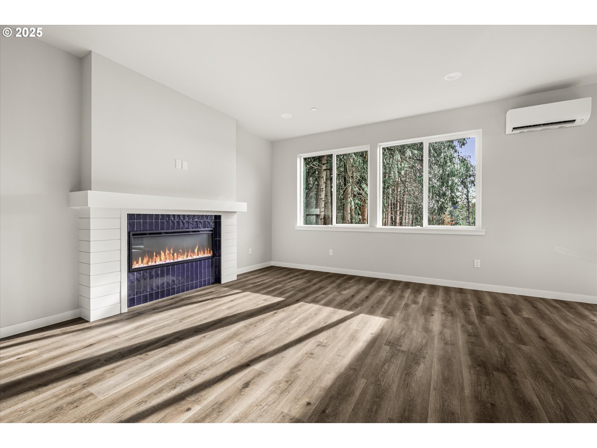 2360 Northwest 3rd Street Gresham, OR 97030 - Photo 15 of 45 a view of an empty room with wooden floor fireplace and a window
