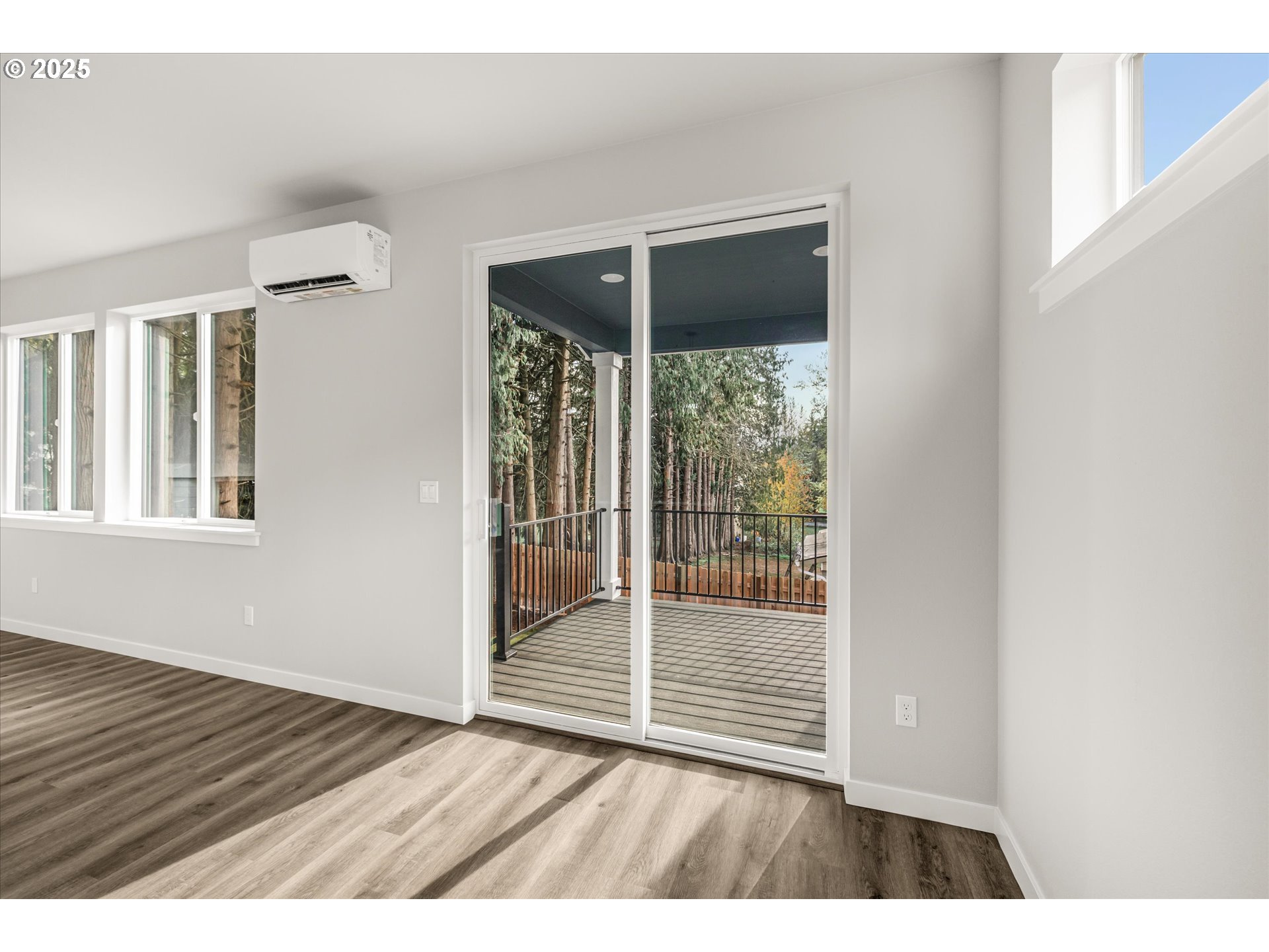 2360 Northwest 3rd Street Gresham, OR 97030 - Photo 18 of 45 a view of an empty room with wooden floor and a window