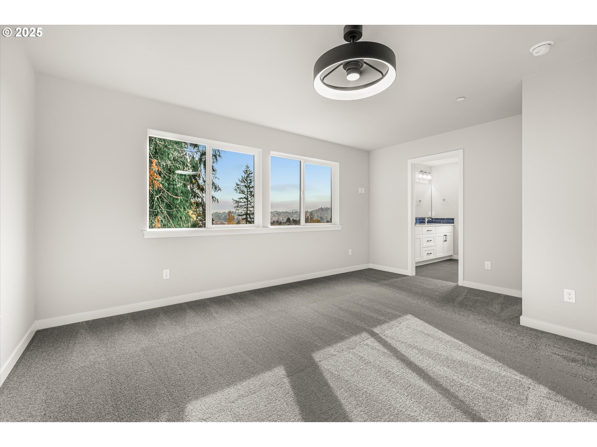 2360 Northwest 3rd Street Gresham, OR 97030 - Photo 29 of 45 a view of an empty room with wooden floor and a window