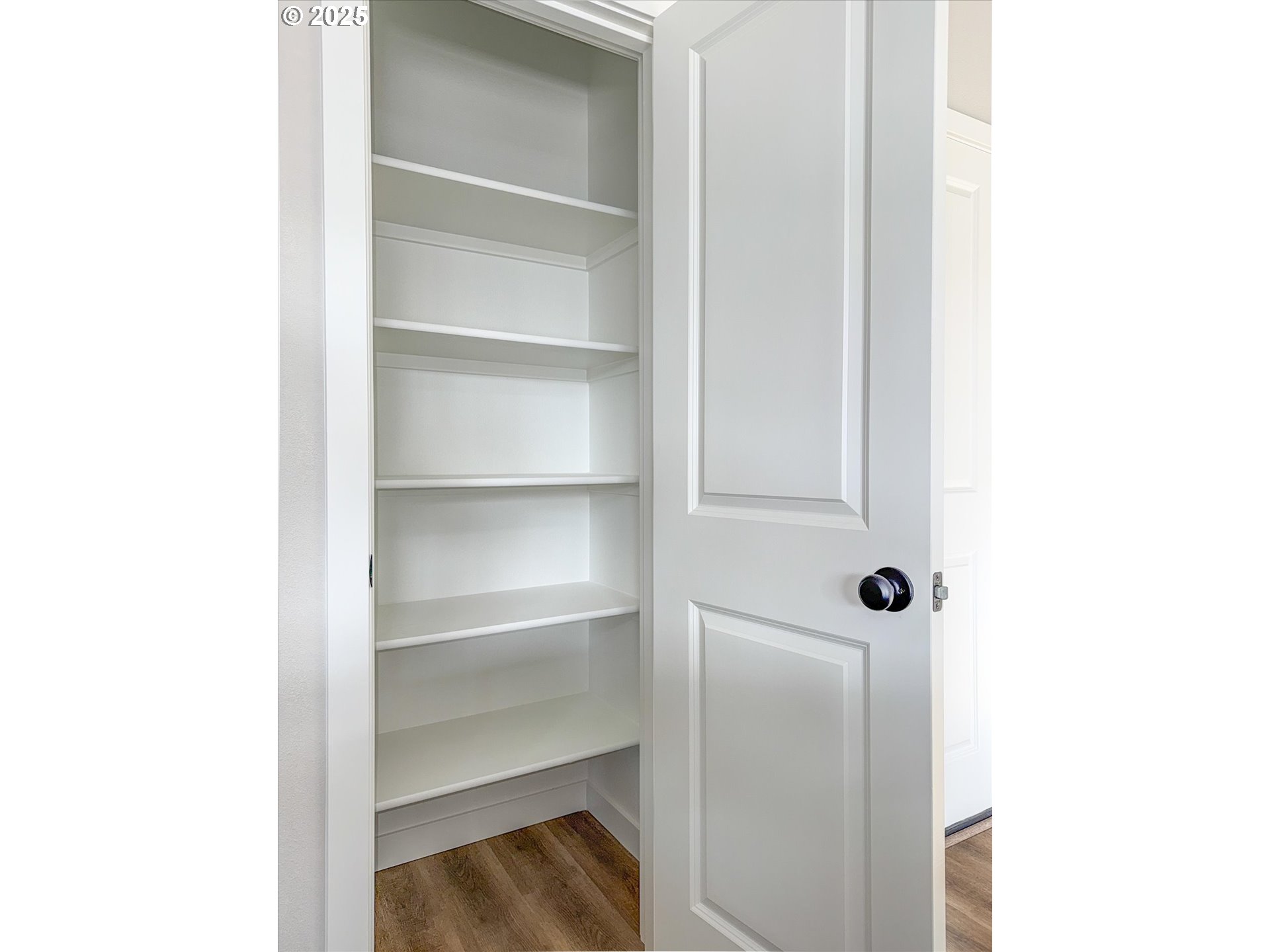 2360 Northwest 3rd Street Gresham, OR 97030 - Photo 42 of 45 a walk in closet with wooden floor