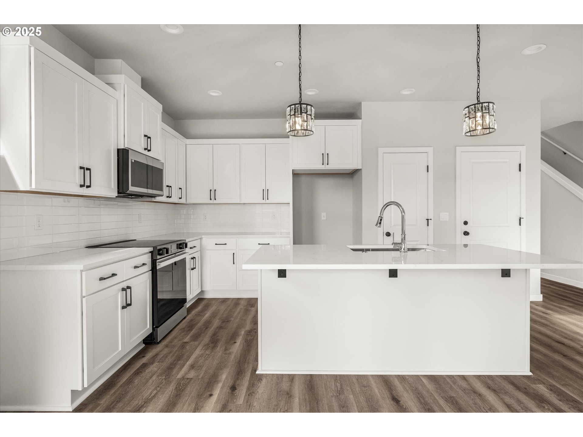 2360 Northwest 3rd Street Gresham, OR 97030 - Photo 10 of 45 a kitchen with kitchen island white cabinets and stainless steel appliances