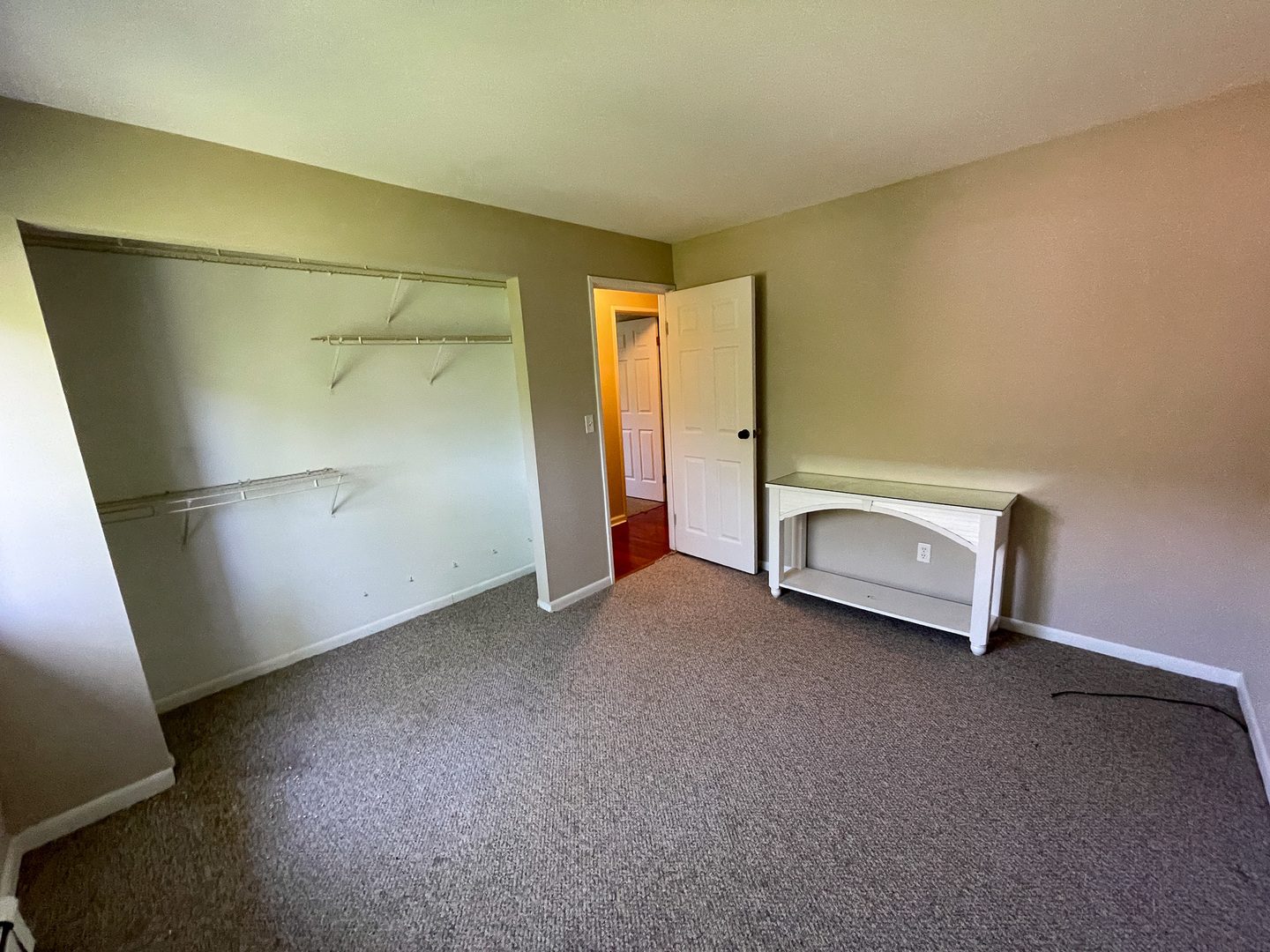 19360 Wolf Road, Unit 8 Mokena, IL 60448 - Photo 17 of 23 a view of an empty room with a glass door