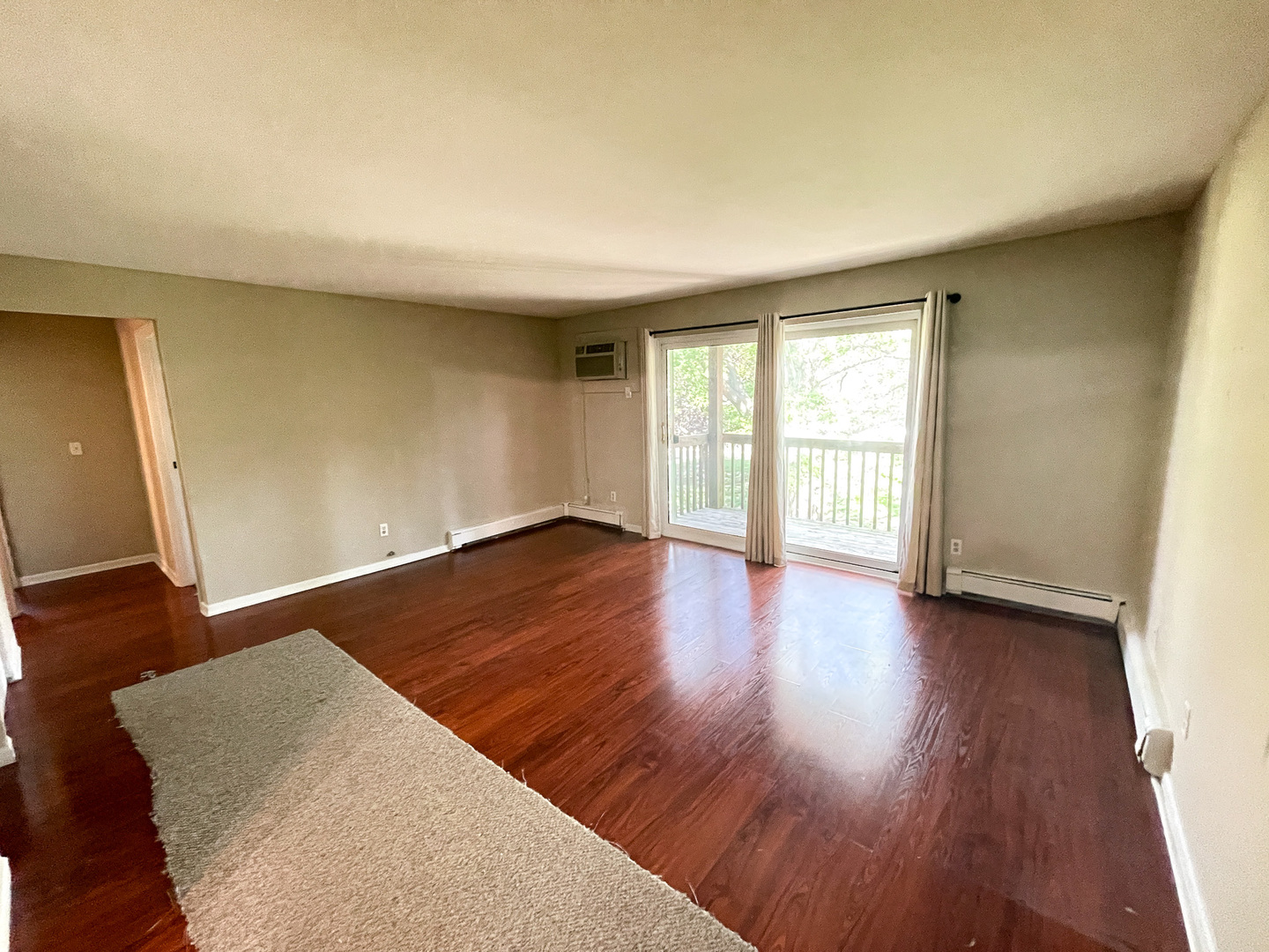 19360 Wolf Road, Unit 8 Mokena, IL 60448 - Photo 4 of 23 wooden floor in an empty room with a window