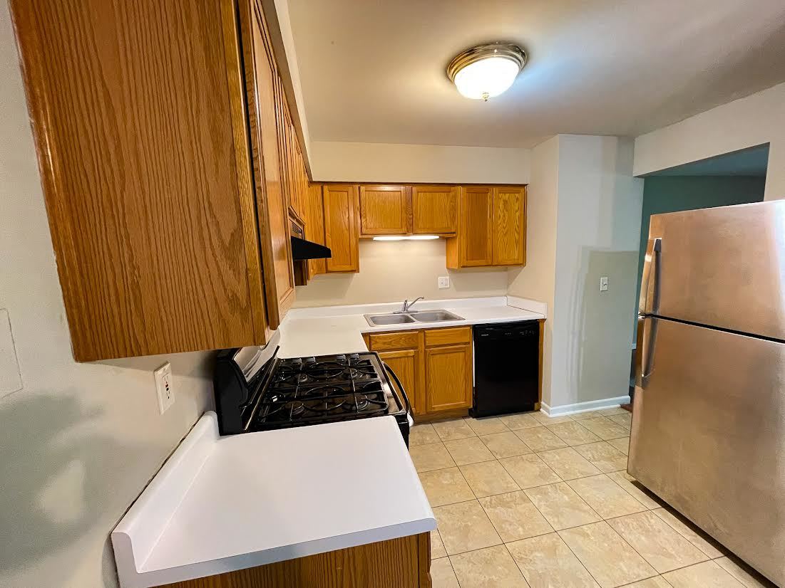 19360 Wolf Road, Unit 8 Mokena, IL 60448 - Photo 10 of 23 a kitchen with a refrigerator and a stove