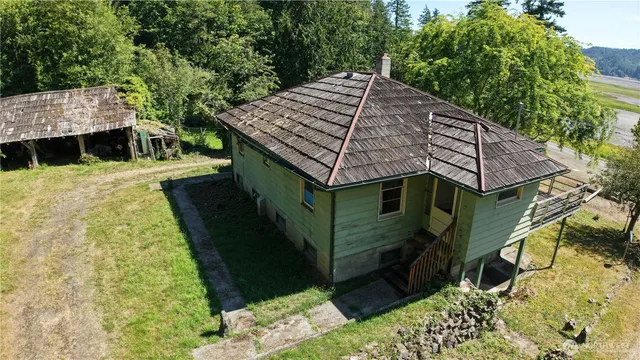 a aerial view of a house with a yard