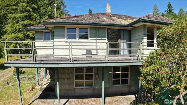 a view of a house with a window and wooden floor