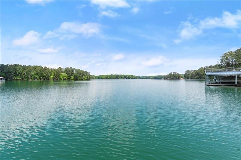 4290 Bobbins Way Cumming, GA 30041 - Photo 103 of 133 a view of a lake with houses in the back