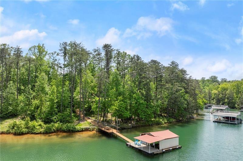 4290 Bobbins Way Cumming, GA 30041 - Photo 13 of 133 a swimming pool with trees in the background