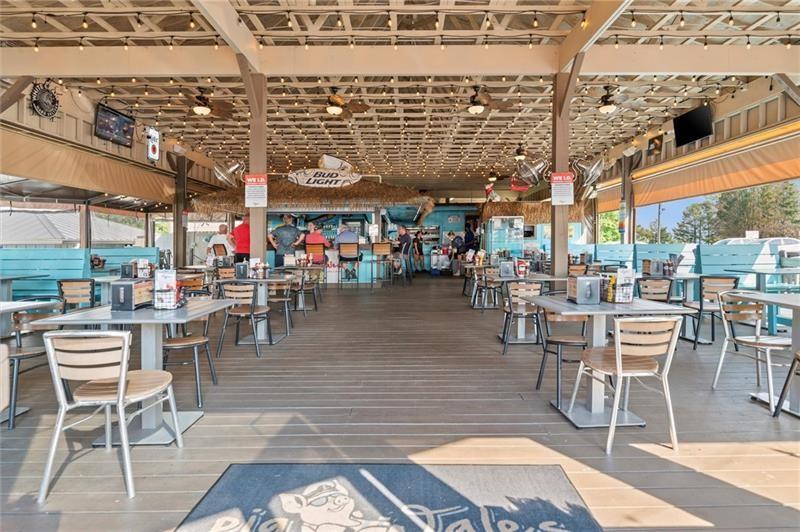 4290 Bobbins Way Cumming, GA 30041 - Photo 132 of 133 a outdoor space with lots of tables a chairs and chandelier