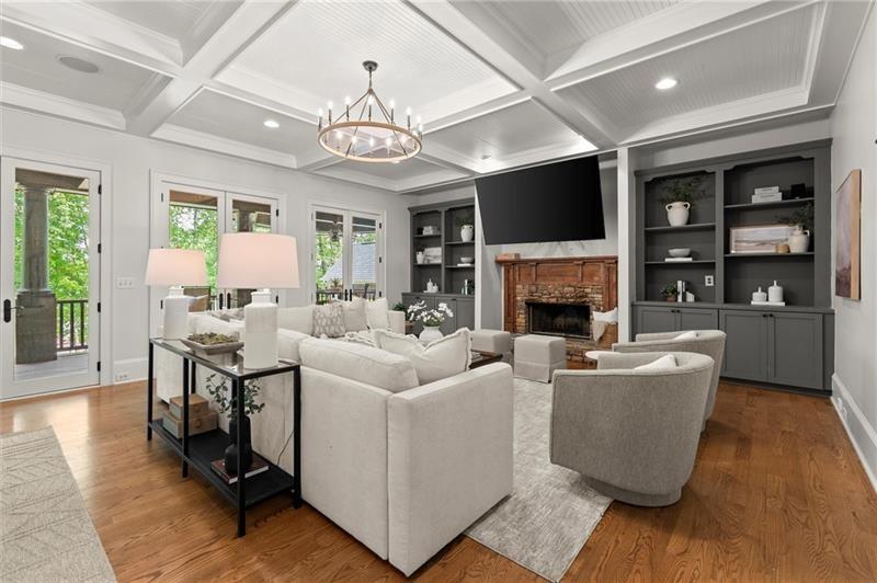 4290 Bobbins Way Cumming, GA 30041 - Photo 26 of 133 a living room with furniture a flat screen tv and a fireplace