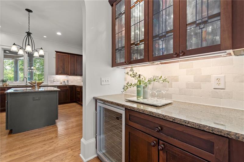 4290 Bobbins Way Cumming, GA 30041 - Photo 30 of 133 a kitchen with stainless steel appliances granite countertop a sink dishwasher and a wooden cabinets