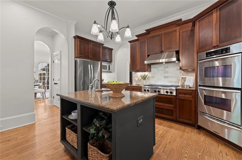 4290 Bobbins Way Cumming, GA 30041 - Photo 33 of 133 a kitchen with stainless steel appliances granite countertop a oven a stove and a refrigerator