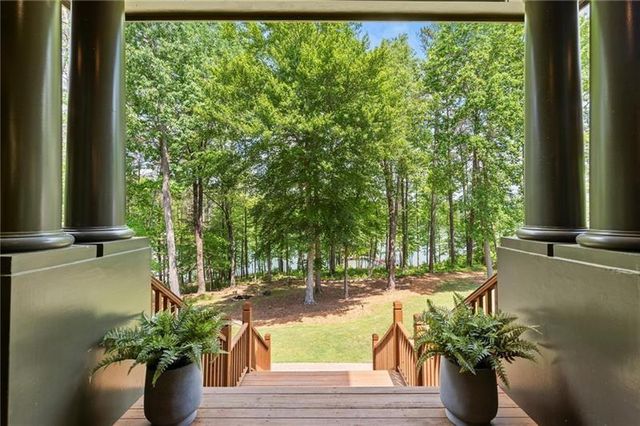 a view of a dining room with furniture and window