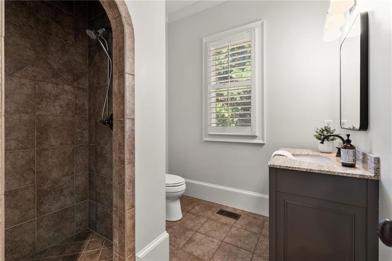 4290 Bobbins Way Cumming, GA 30041 - Photo 48 of 133 a bathroom with a granite countertop sink toilet and shower