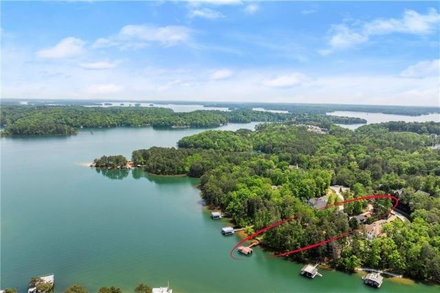 an aerial view of a house with outdoor space