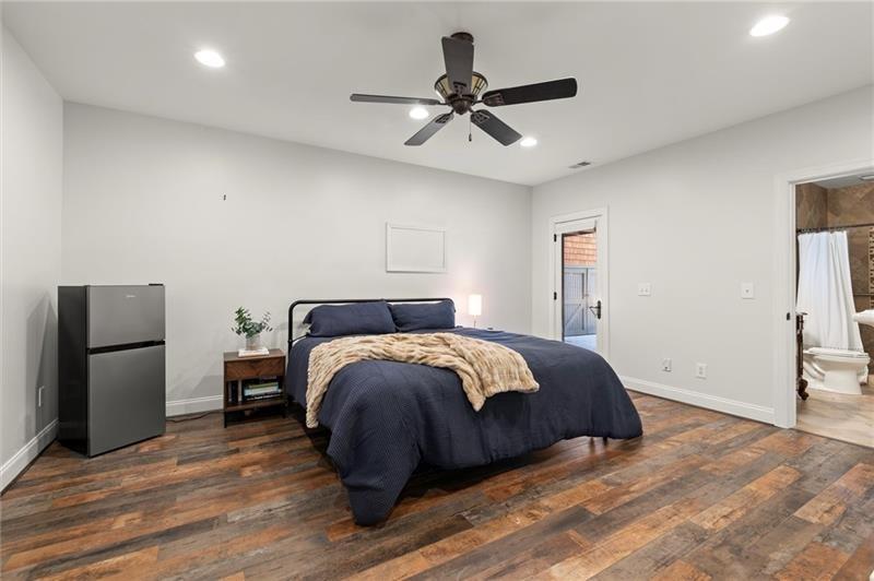 4290 Bobbins Way Cumming, GA 30041 - Photo 86 of 133 a spacious bedroom with a bed and a ceiling fan
