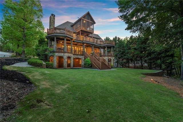 a view of a dining room with furniture wooden floor and chandelier