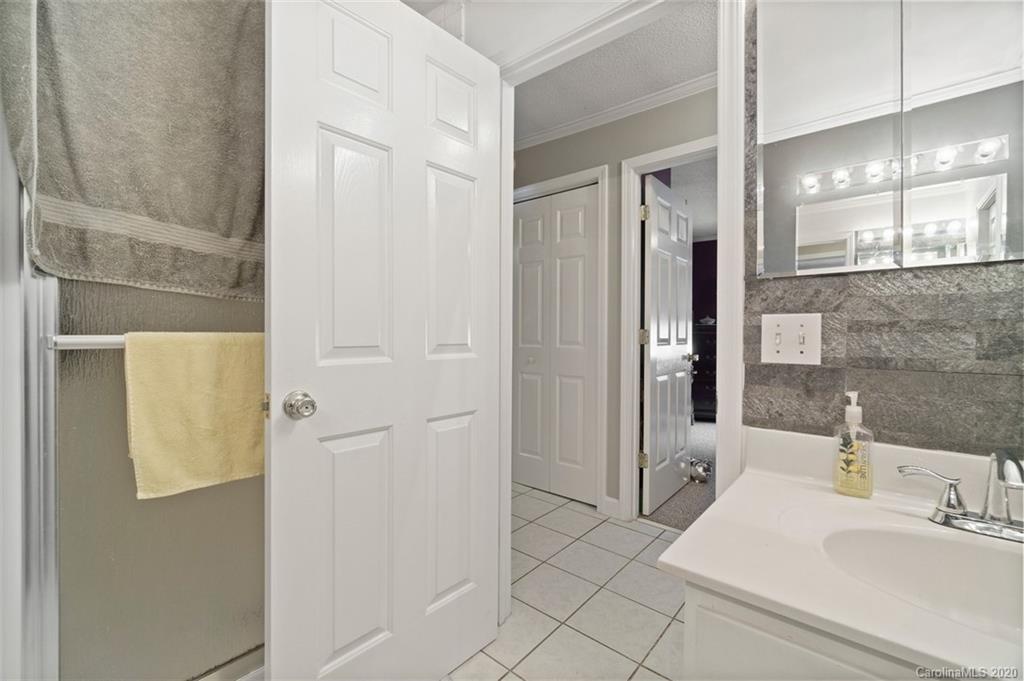 185 Hunter Bridge Road Stony Point, NC 28678 - Photo 21 of 47 a bathroom with a sink and a mirror